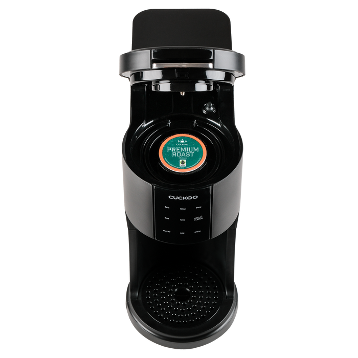 Black CUCKOO K-Cup single-serve coffee maker with open lid, showing the internal capsule holder loaded with a coffee pod. (CCM-AK011B)