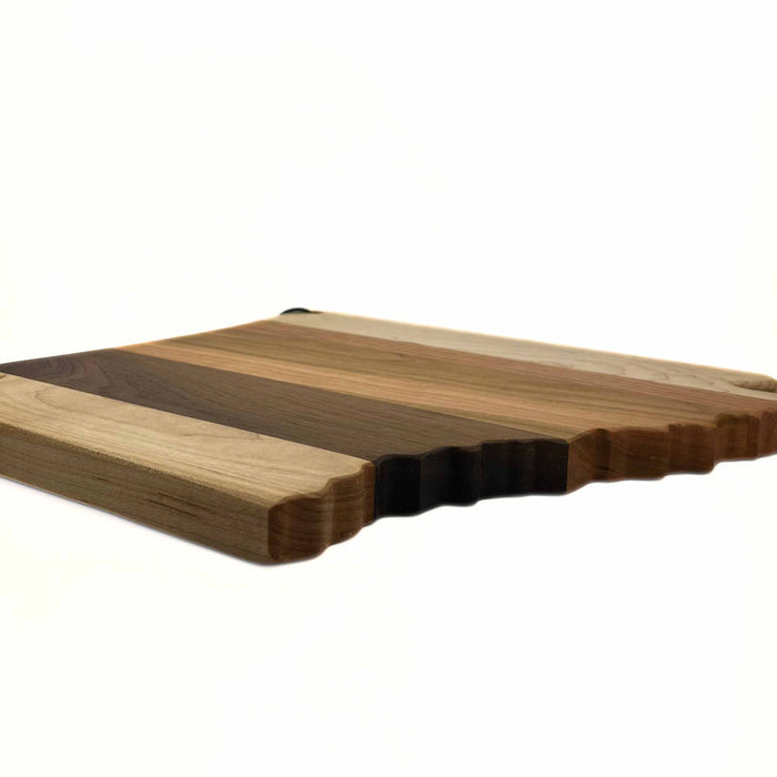 Side view of Arkansas-shaped cutting board with mixed wood types