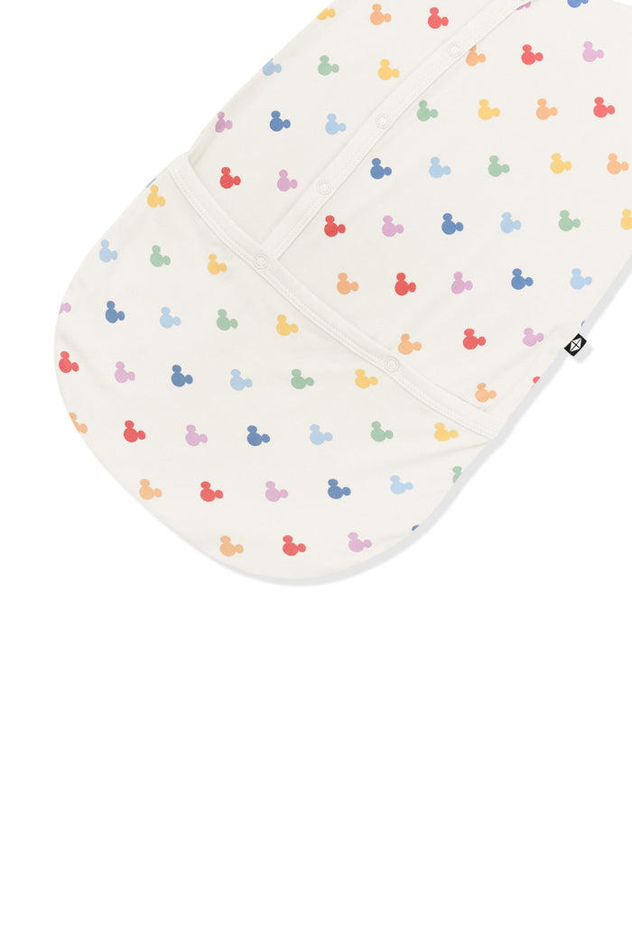 Bottom part of bundler in colorful mickey mouse icons on an oat background