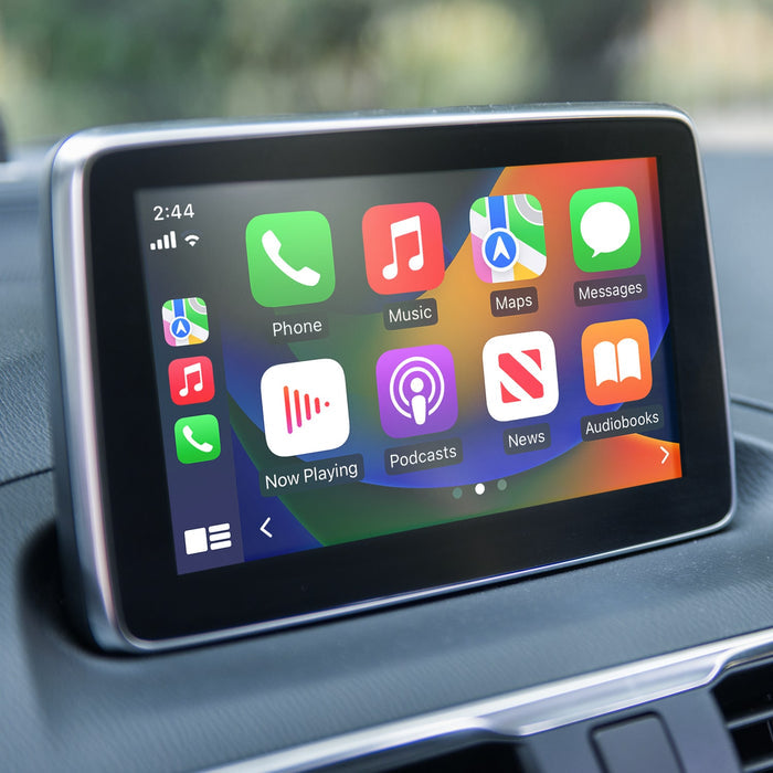 Car infotainment screen showing CarPlay apps connected through wireless adapter