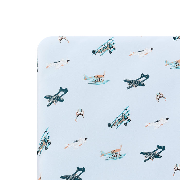 Close up of the Crib Sheet in Take Off on a mattress
