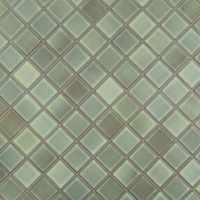 Caption: Classic Field 2x2 in G120 Lemon Ice. Prism Driftwood grout by Custom Building Products.
