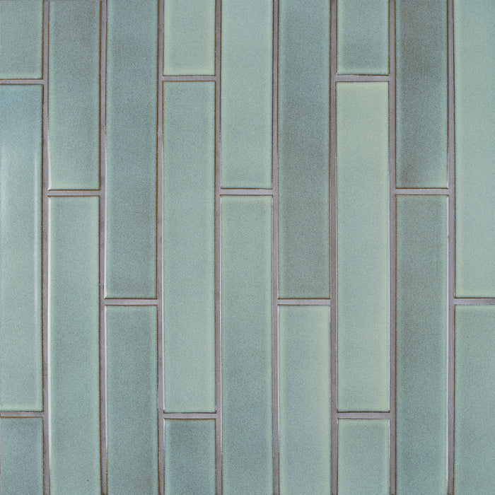Caption: Classic Field 2x12 in G122 Serpentine. Natural grey grout by Custom Building Products.