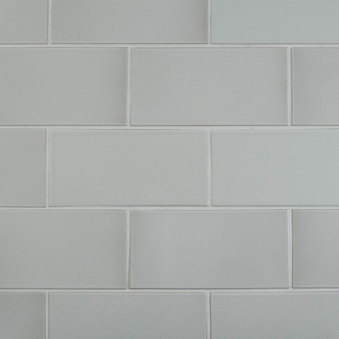 Caption: Classic Field 4x8 in G134 Polo Grey Manganese. Prism Cape Grey grout by Custom Building Products.