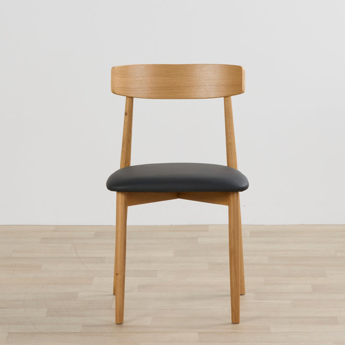 front view of the henry dining chair black oak