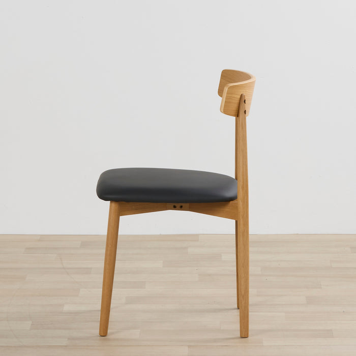 side view of the henry dining chair black oak