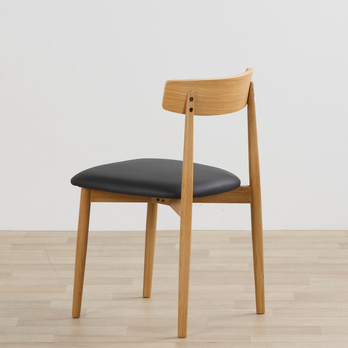 back side view of the henry dining chair black oak