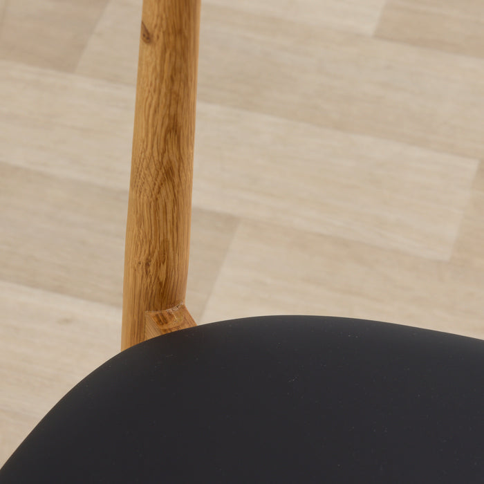close up of the henry dining chair in oak back