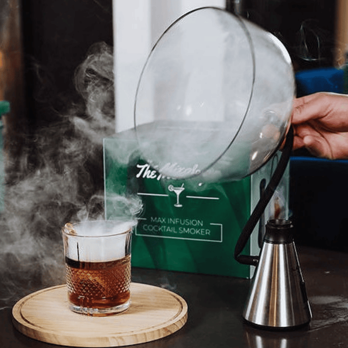 Cocktail being smoked by Max Infusion Cocktail Smoker