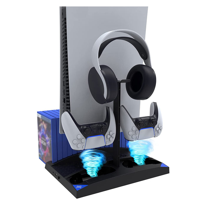 PS5 console, controllers, games, and headset on a black charging dock while someone works
