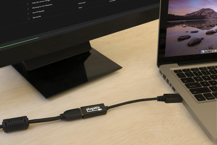 Plugable DisplayPort to HDMI adapter connecting a laptop to an external monitor.