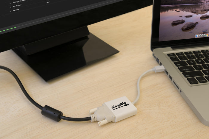 Plugable Mini DisplayPort to DVI adapter connecting a laptop to an external monitor.