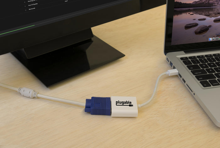Plugable MDPM-VGAF Mini DisplayPort to VGA adapter connecting a laptop to a VGA display.