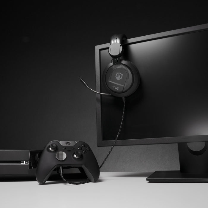 Plugable HS53 gaming headset with retractable microphone connected to an Xbox controller.
