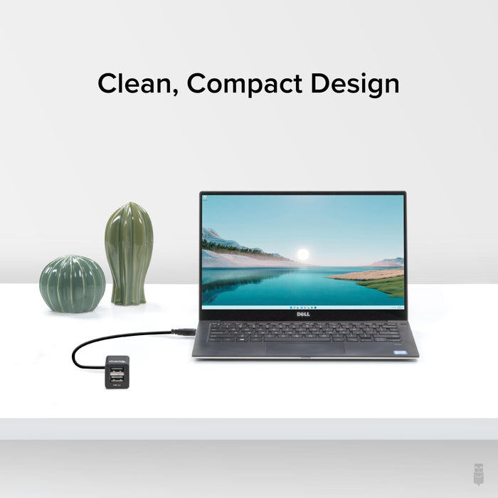 Plugable USB2-2PORT hub connected to a laptop, featuring two USB 2.0 ports in a compact design.