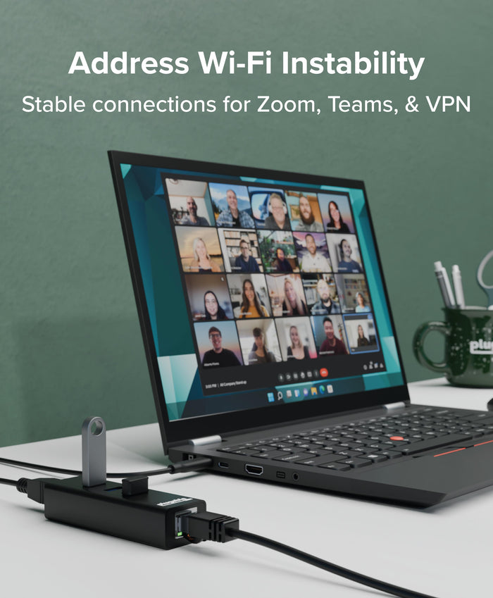 Plugable USB 3.0 hub with Gigabit Ethernet connected to a laptop, providing a stable wired network for video calls.