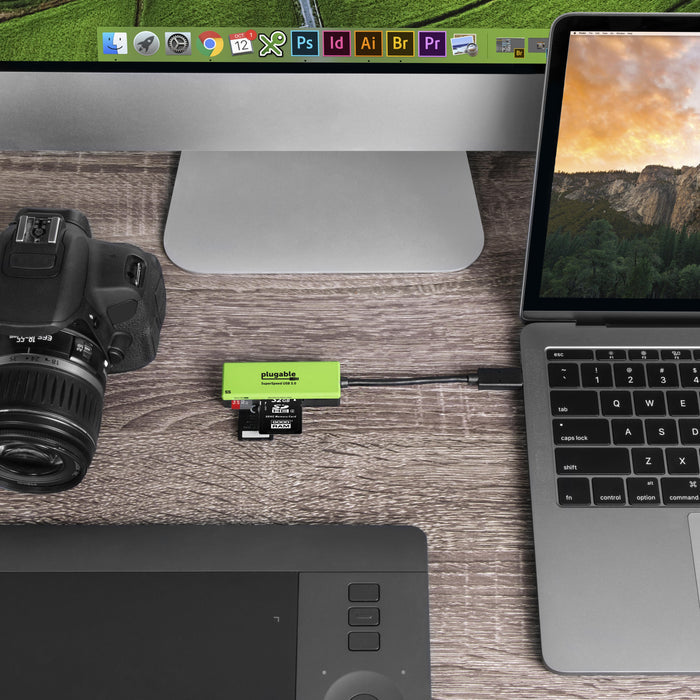 Plugable SuperSpeed USB 3.0 flash memory card reader connected to a laptop with SD and Micro SD cards inserted.