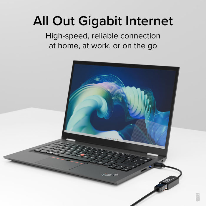Plugable USB 3.0 to Gigabit Ethernet adapter connected to a laptop, providing high-speed wired internet connectivity.