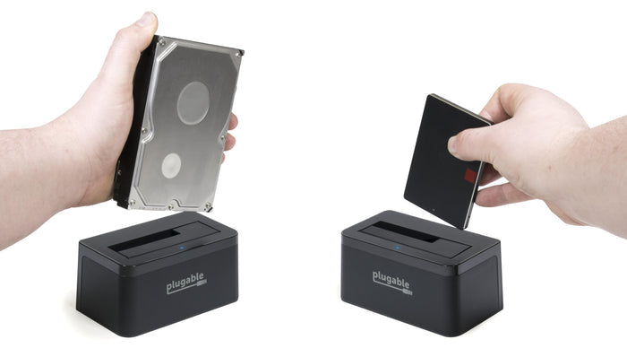 Plugable USBC-SATA-V dock shown with a 3.5-inch hard drive and a 2.5-inch SSD being inserted into the top slot.