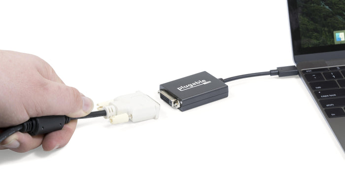 Plugable USB-C to DVI adapter connecting a laptop to a DVI cable.