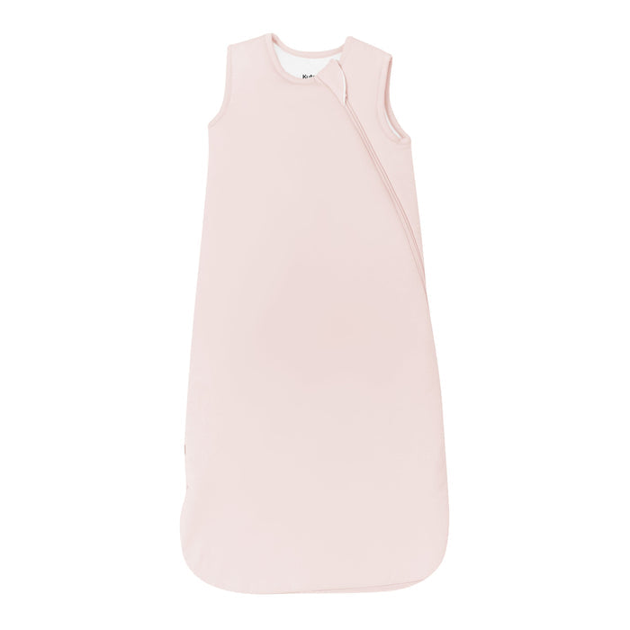 Flay lay of Kyte Baby Sleep Bag in Blush 2.5