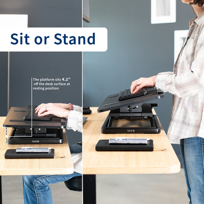 A black tilting keyboard riser with a woman typing at both a sitting and standing height.