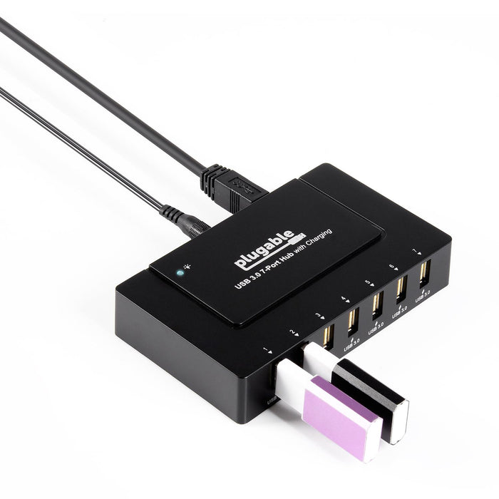 Plugable USB 3.0 7-Port Hub with Charging, featuring seven numbered USB 3.0 ports and two connected USB flash drives.